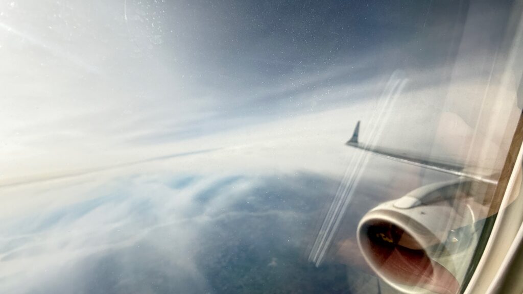 Photo: Final flight home - above the clouds again, thinking about AI and automation
